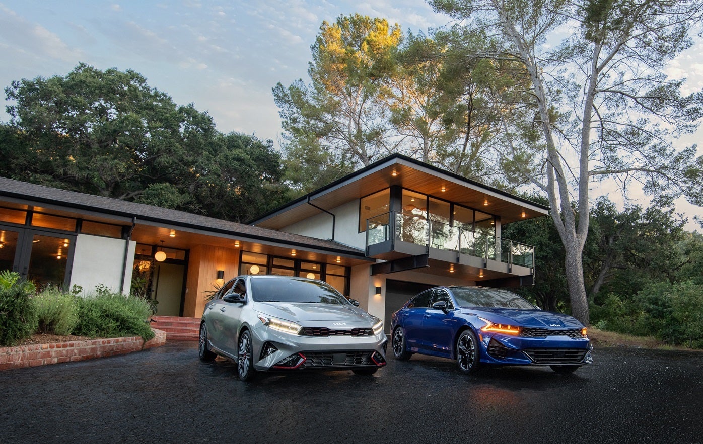 Two Kias in Driveway